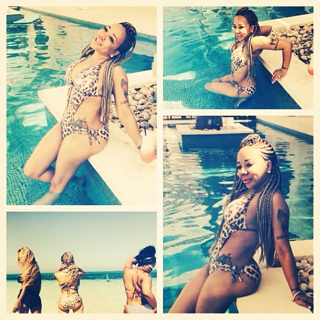 Tiny flaunts her bum in a cut-out one piece.
