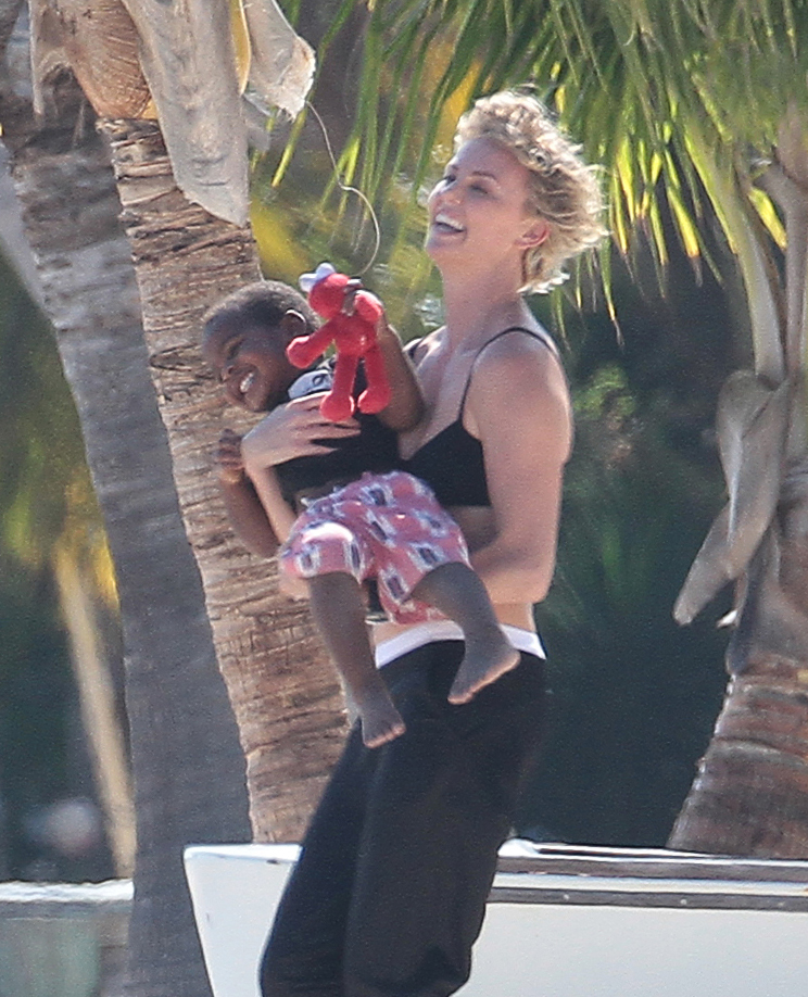 Charlize Theron and her son Jackson playing around on the beach in Miami