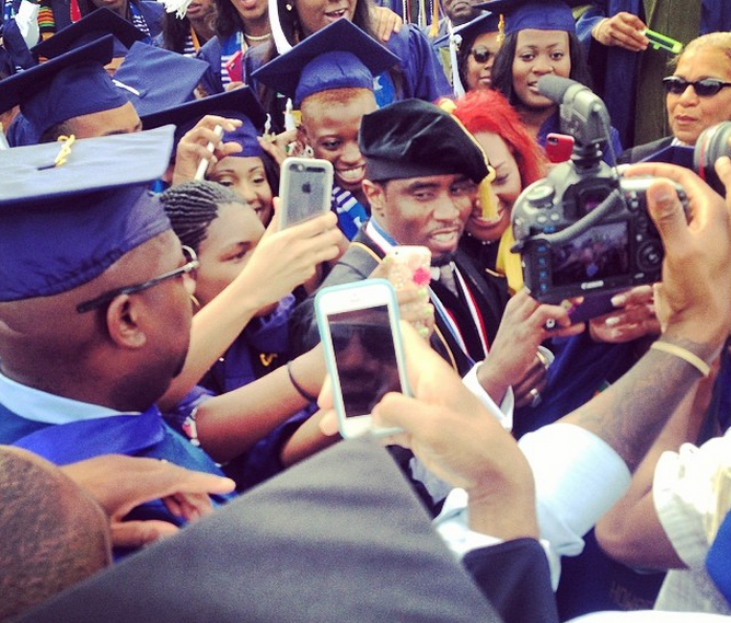 Diddy is surrounded by tons of HU students at their commencement ceremony!