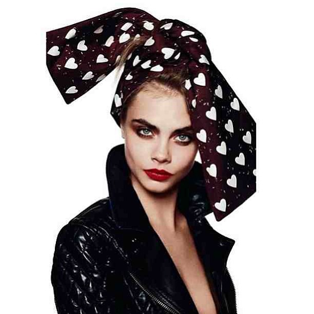 Cara rocks red lips.