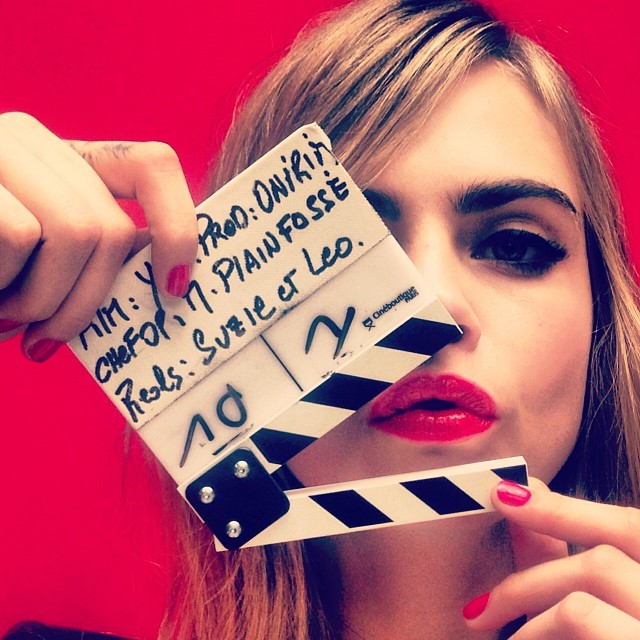 Cara messing around on set.