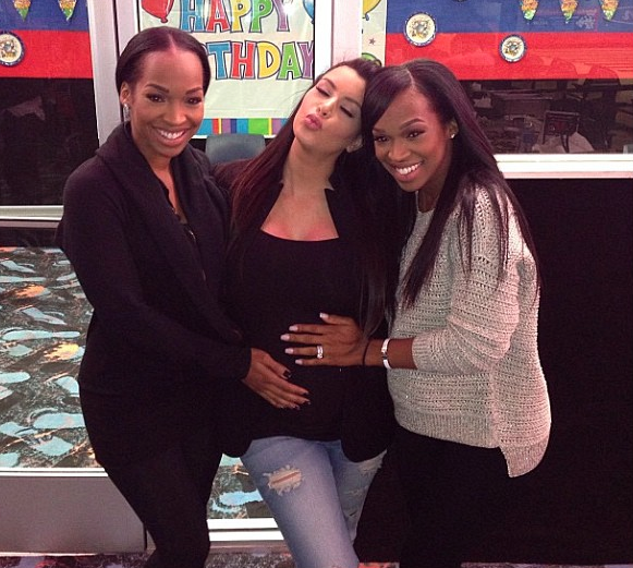 Showing love to a then-pregnant with baby North, Kim Kardashian.