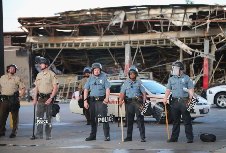 Ferguson police patrol the streets.