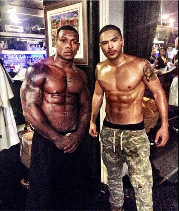 Some of the guys on set show off their abs.