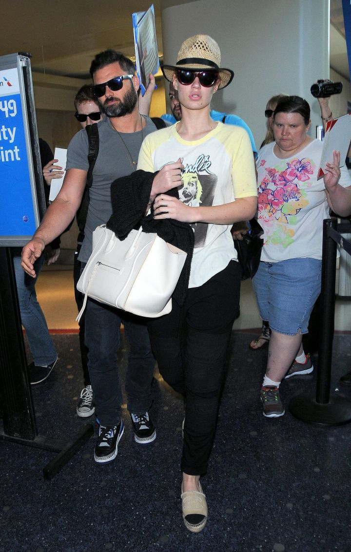 On her grind! Iggy Azalea heads out of LAX looking a little tired.