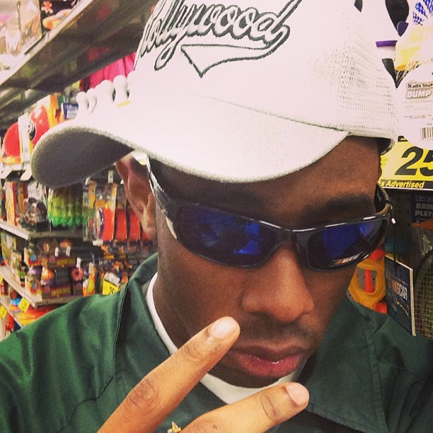 Hat on tilt, sunnies on straight.