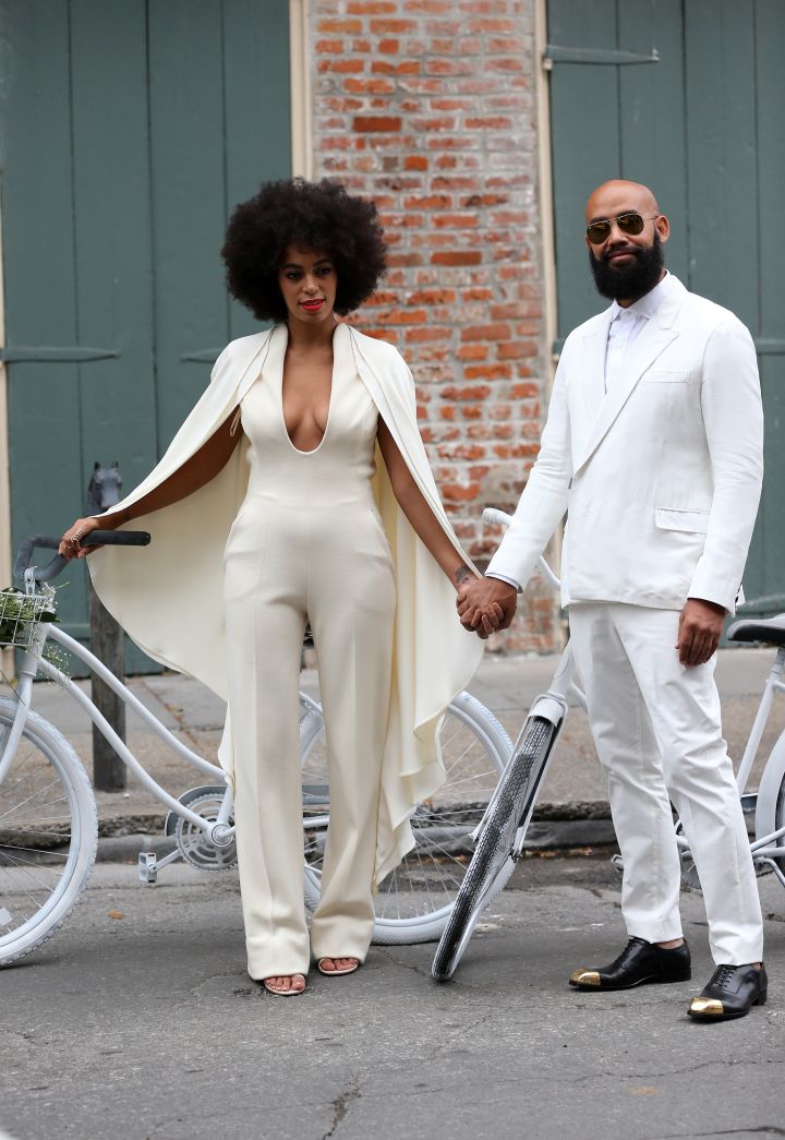 Solange and Alan Ferguson arrive together on bikes for their wedding.