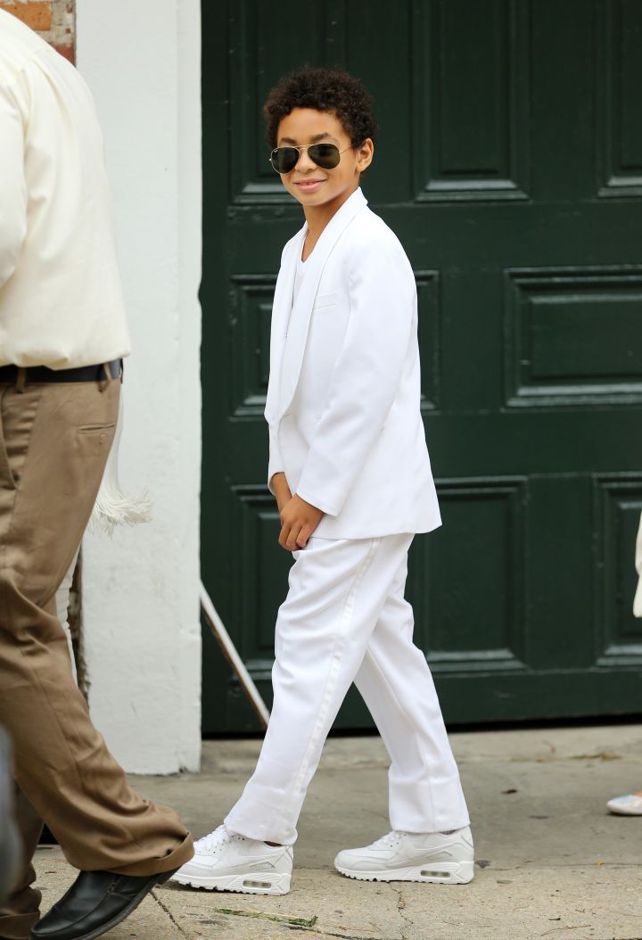 Solange’s son Julez steps out wearing all white and shades for his mom’s wedding.