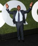 Dave Chappelle posed with his hands up for Mike Brown on the red carpet.