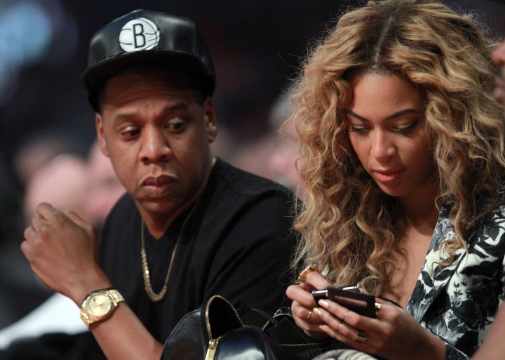 Bey ain’t the only one watching texts courtside. We caught you, Hov.