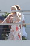 Lindsay Lohan had a major wardrobe malfunction as her breast popped out of her dress as she took to the rooftop of the Raleigh Hotel for a Plum magazine shoot.