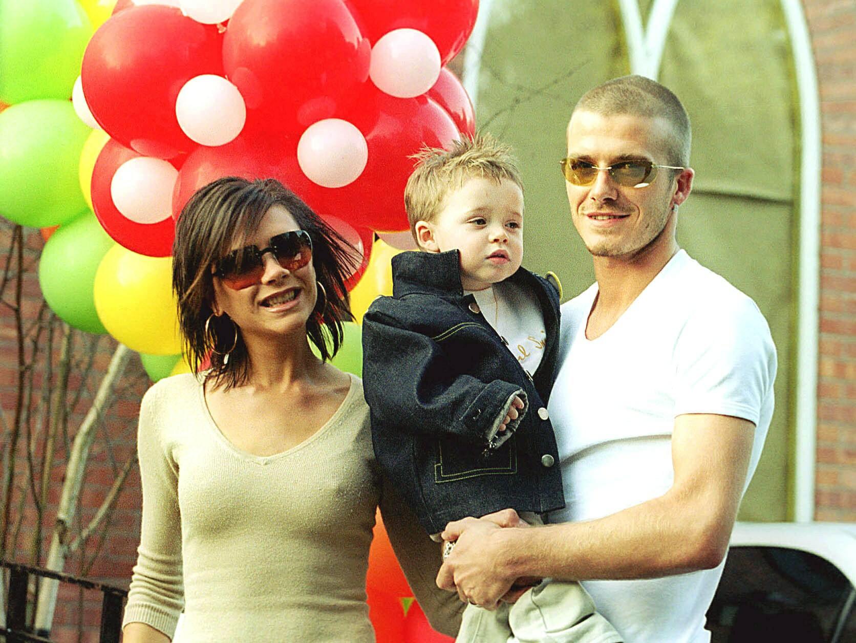 Victoria, David, and their first son in the early 2000s.