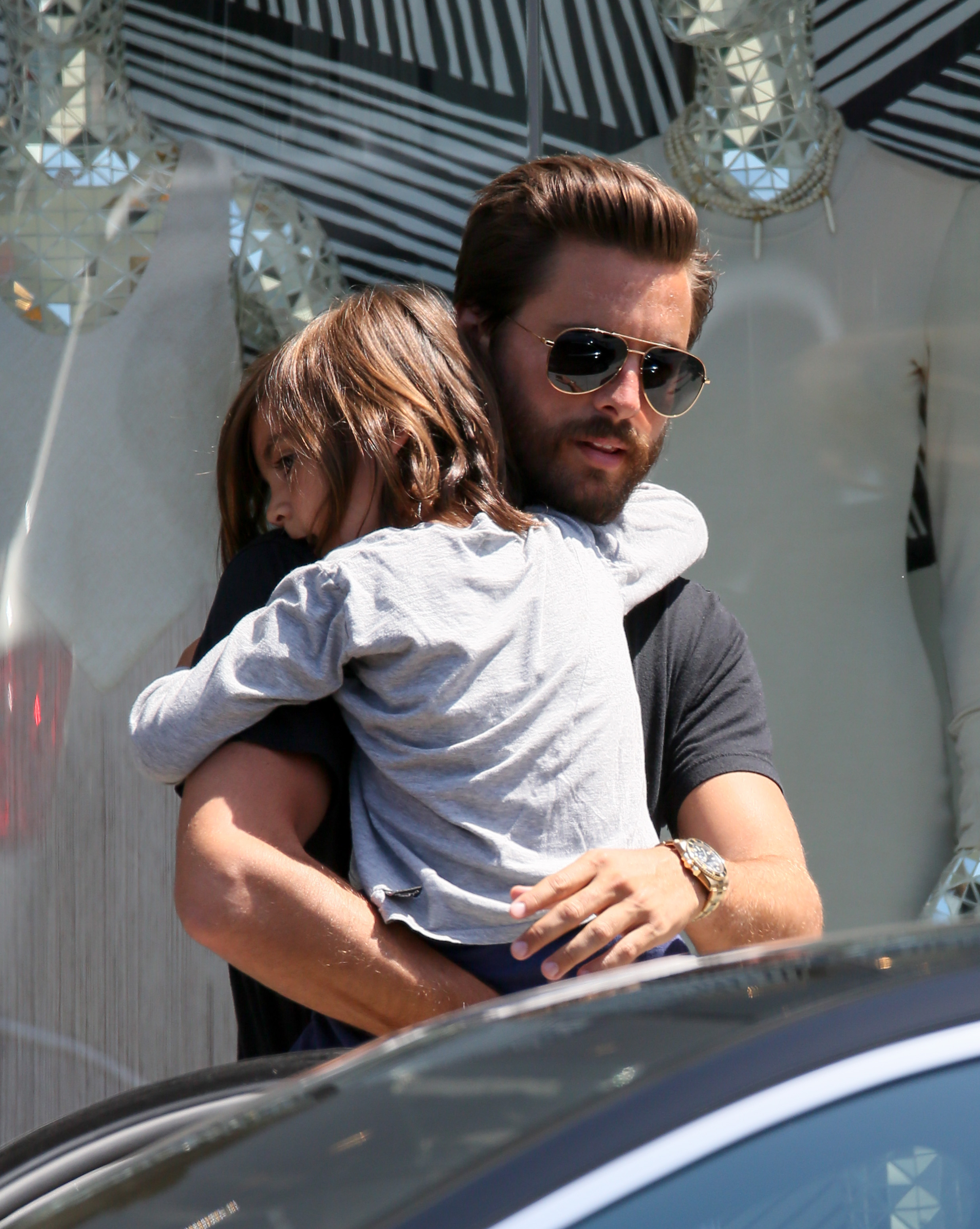 Khloe Kardashian, Kourtney Kardashian, Scott Disick shop at DASH