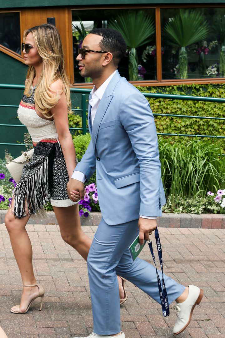Chrissy Teigen and John Legend were spotted holding hands while arriving at Wimbledon.