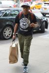 Spike Lee is always willing to make a statement. Here he is holding up his peace sign necklace while wearing a “Guns Kill” t-shirt in downtown Manhattan.