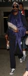 Hair tied, sweatpants, chilling with no makeup on. Snoop Dogg decided to keep it casual for his trip to LAX.
