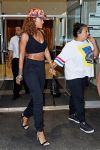 Rihanna held hands with her bestie while leaving the dentist’s office in a crop top, high-waisted pants, and heels in Soho, NYC.