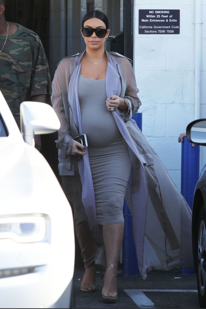 Kim Kardashian wore fifty shades of gray while leaving the studio with Kanye West after filming “Keeping Up with the Kardashians” in Los Angeles.