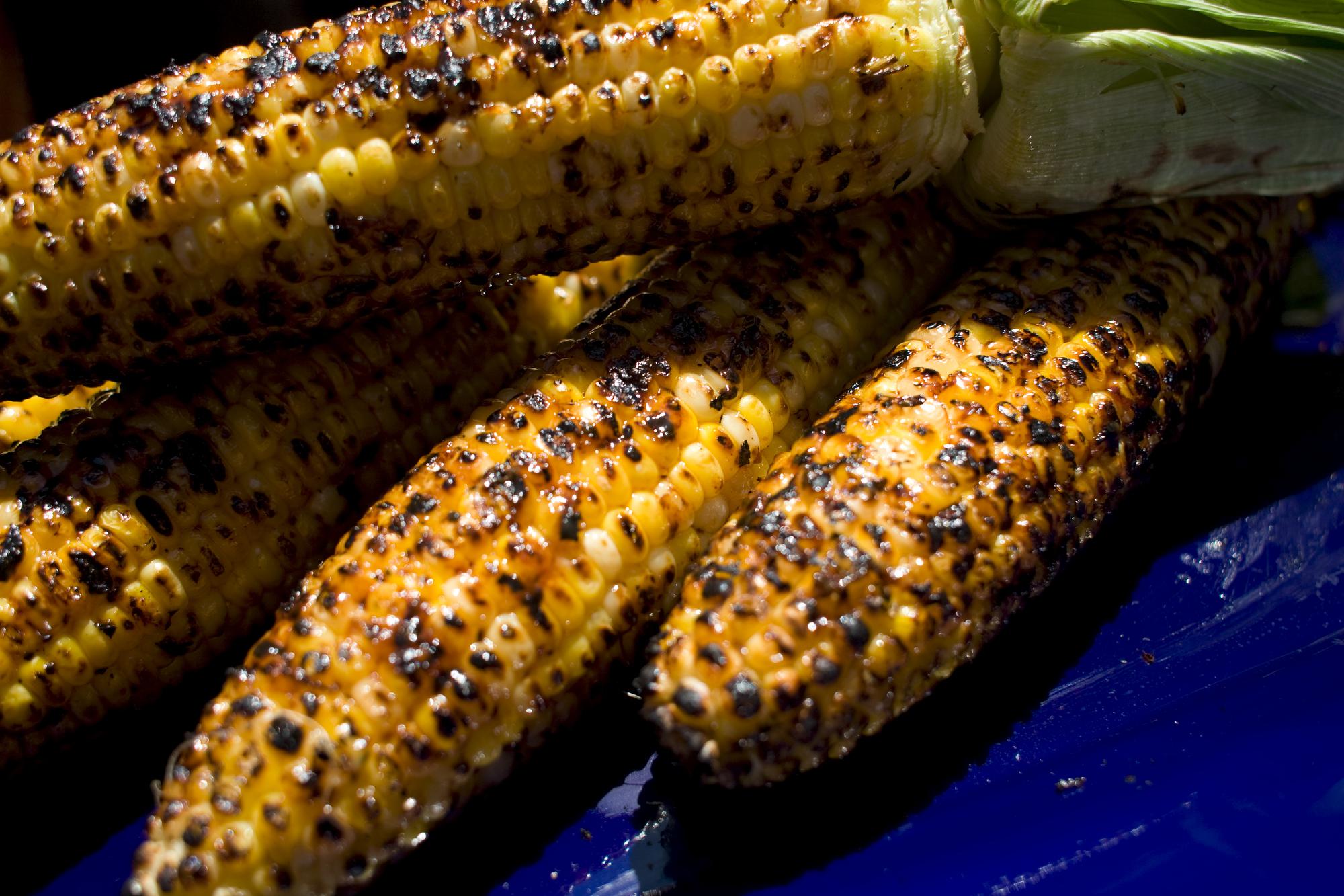 Cambodian Grilled Corn is basted with a mix of coconut milk and