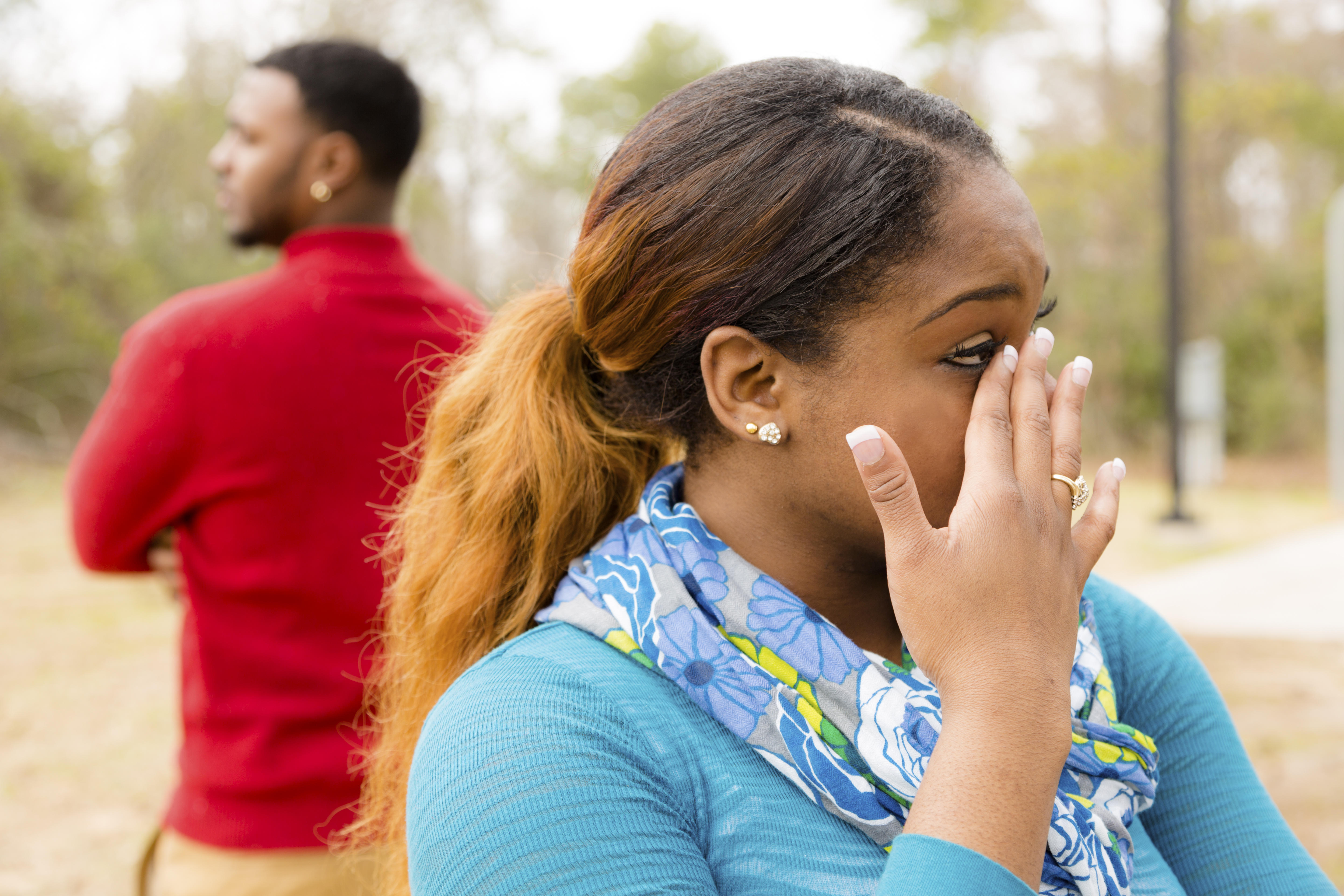 Conflict, arguement between African descent couple. Sadness, crying, anger.