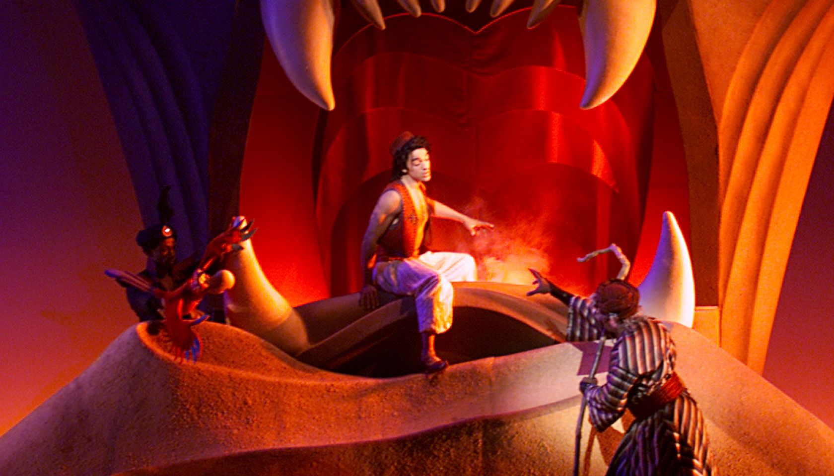 Center,left and rightIn the scene 'Cave of Wonders' Aladdin, portrayed by Miles Wesley, is surround