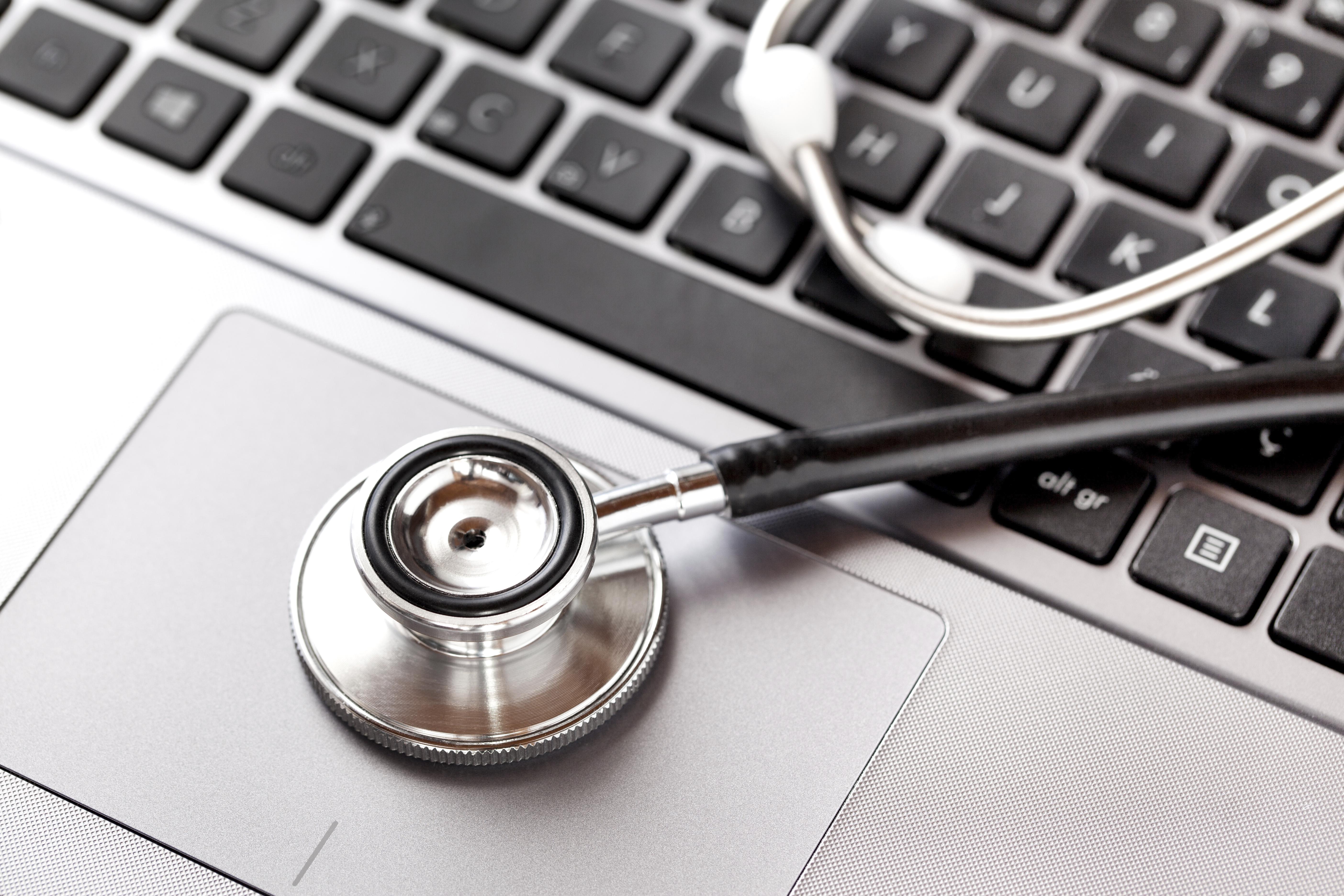 Close up of stethoscope on laptop