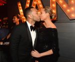 Smooches. Chrissy Teigen couldn’t make a face this time as her husband John Legend planted a wet one on her.