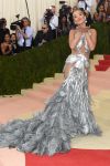 Rita Ora’s feather and sheer gown by Vera Wang is nothing short of epic.