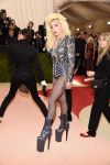 Lady Gaga goes for a bold look in sky-high boots.