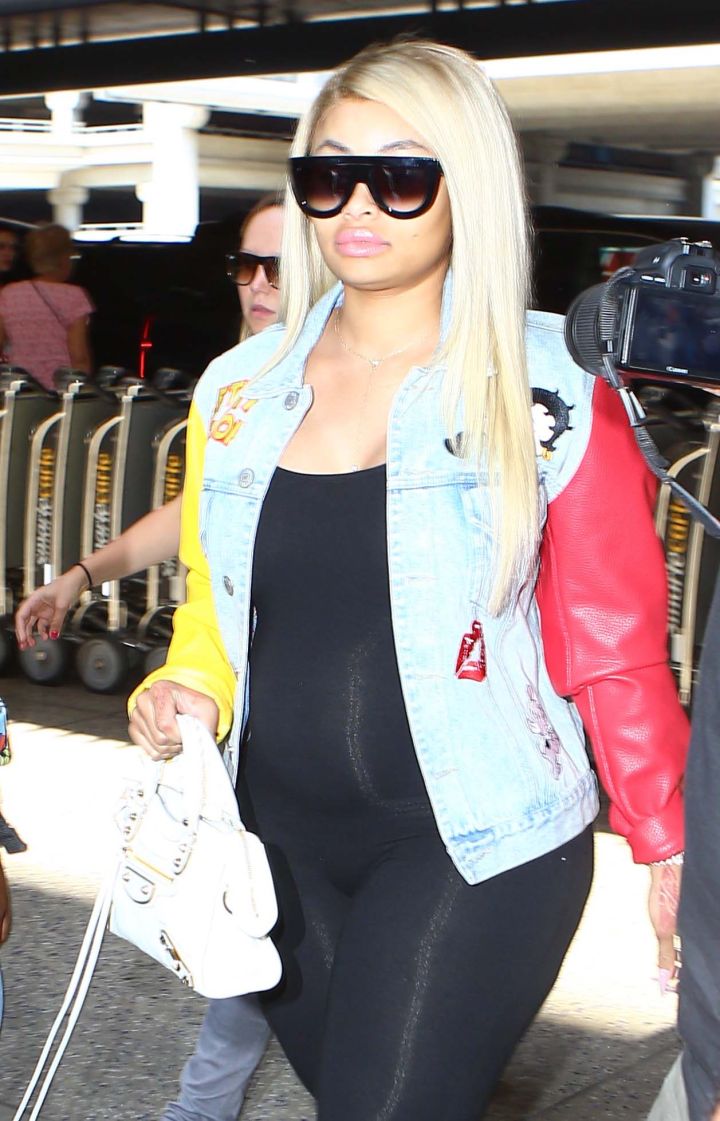 Pregnant. Traveling overseas. And still looking fierce. No sweats and neck pillows for Chyna.