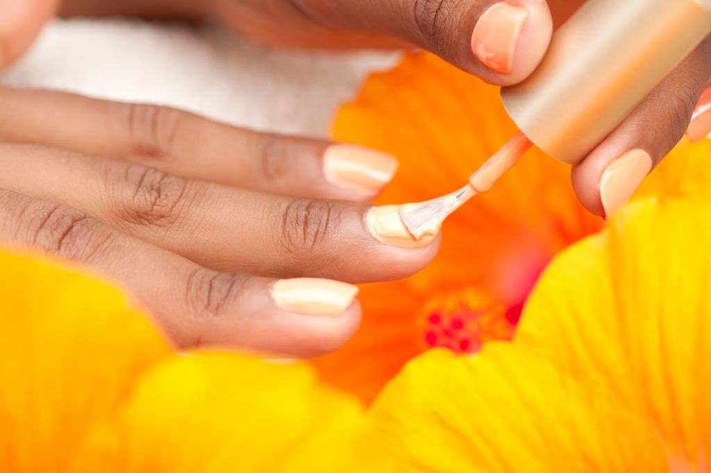Woman applying nail polish