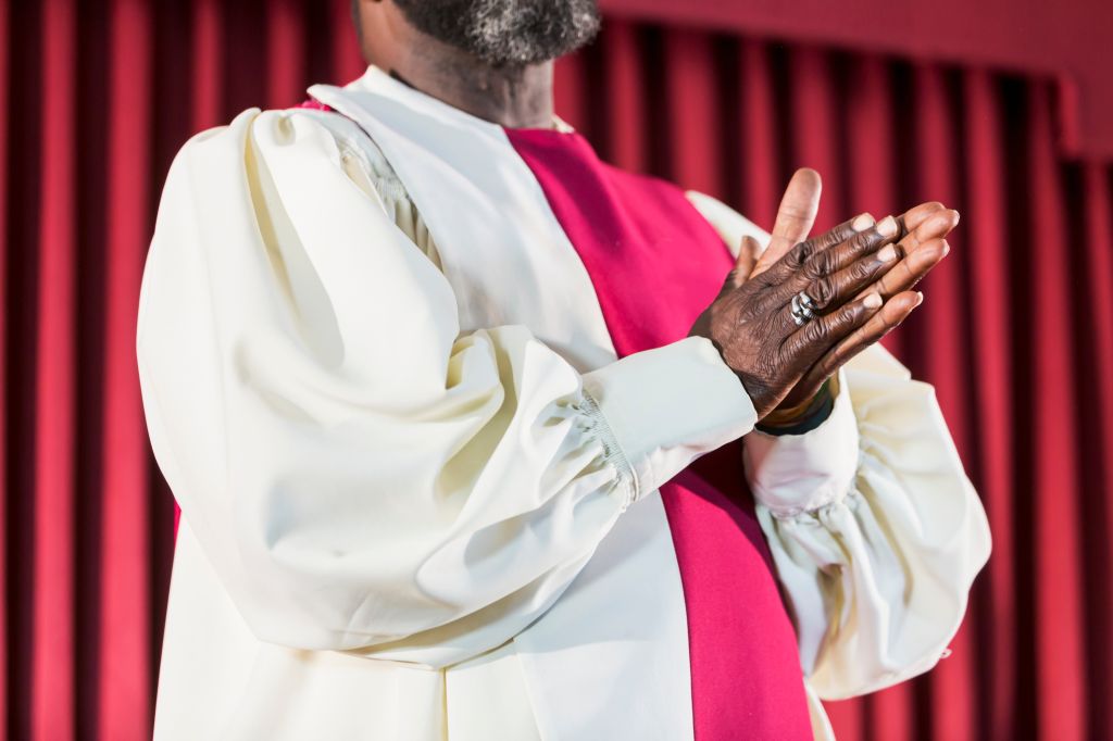 Cropped view of black man in church choir robe