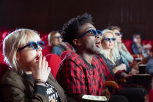 Young people in 3D movie theater