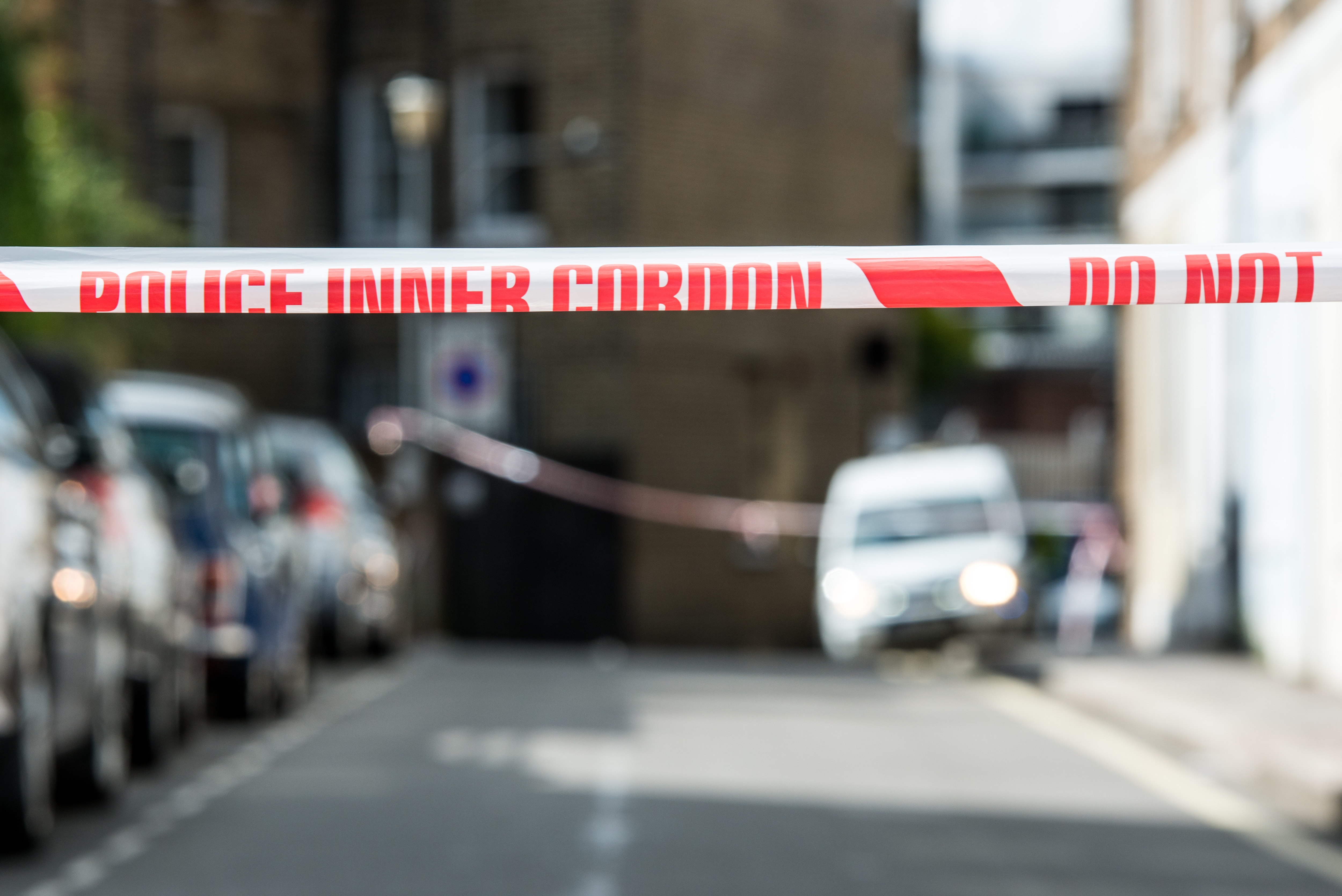 A Police cordon is tied round a local street sign at Parsons...