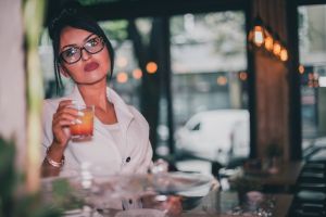 Young woman relaxing at the bar