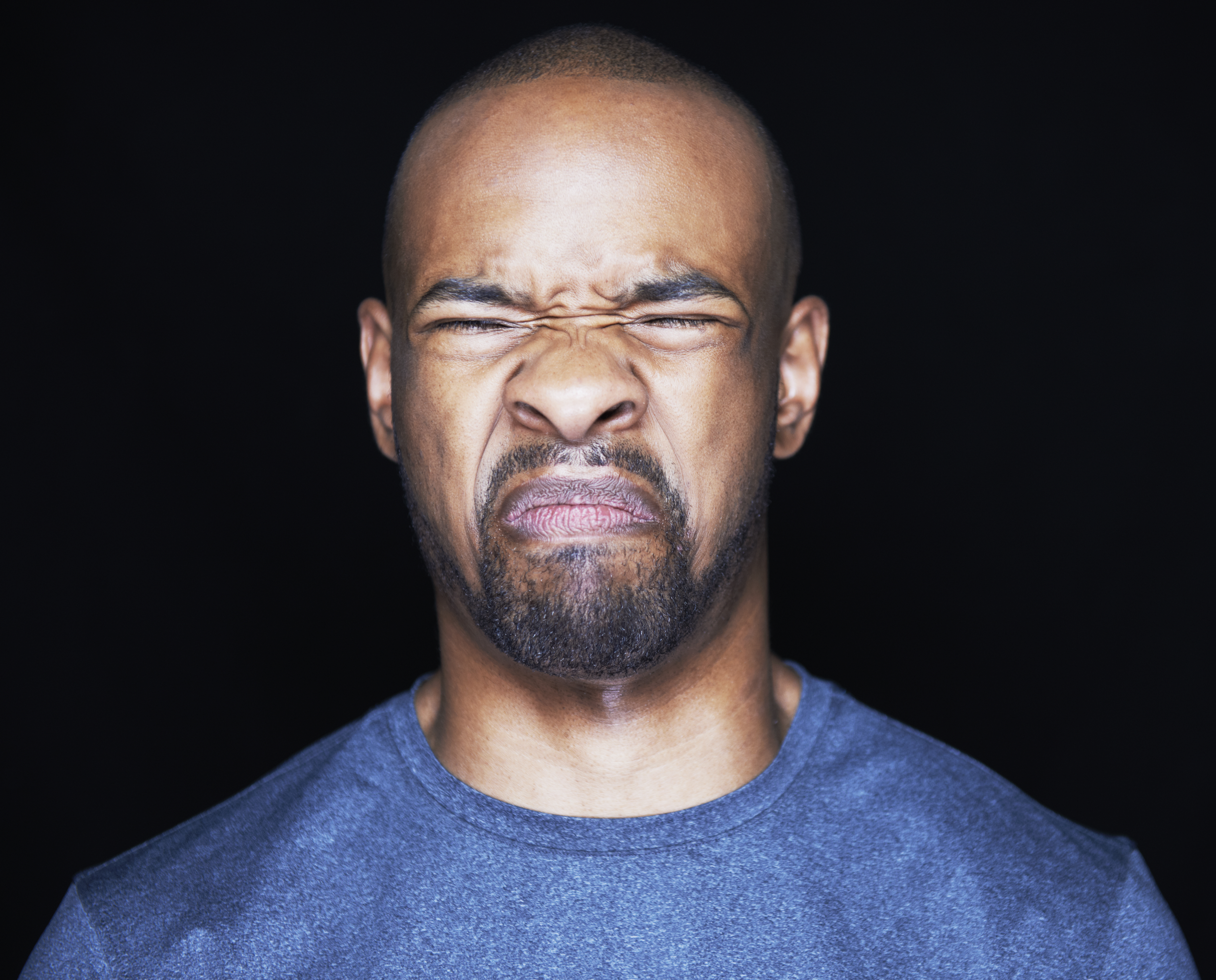 man grimacing