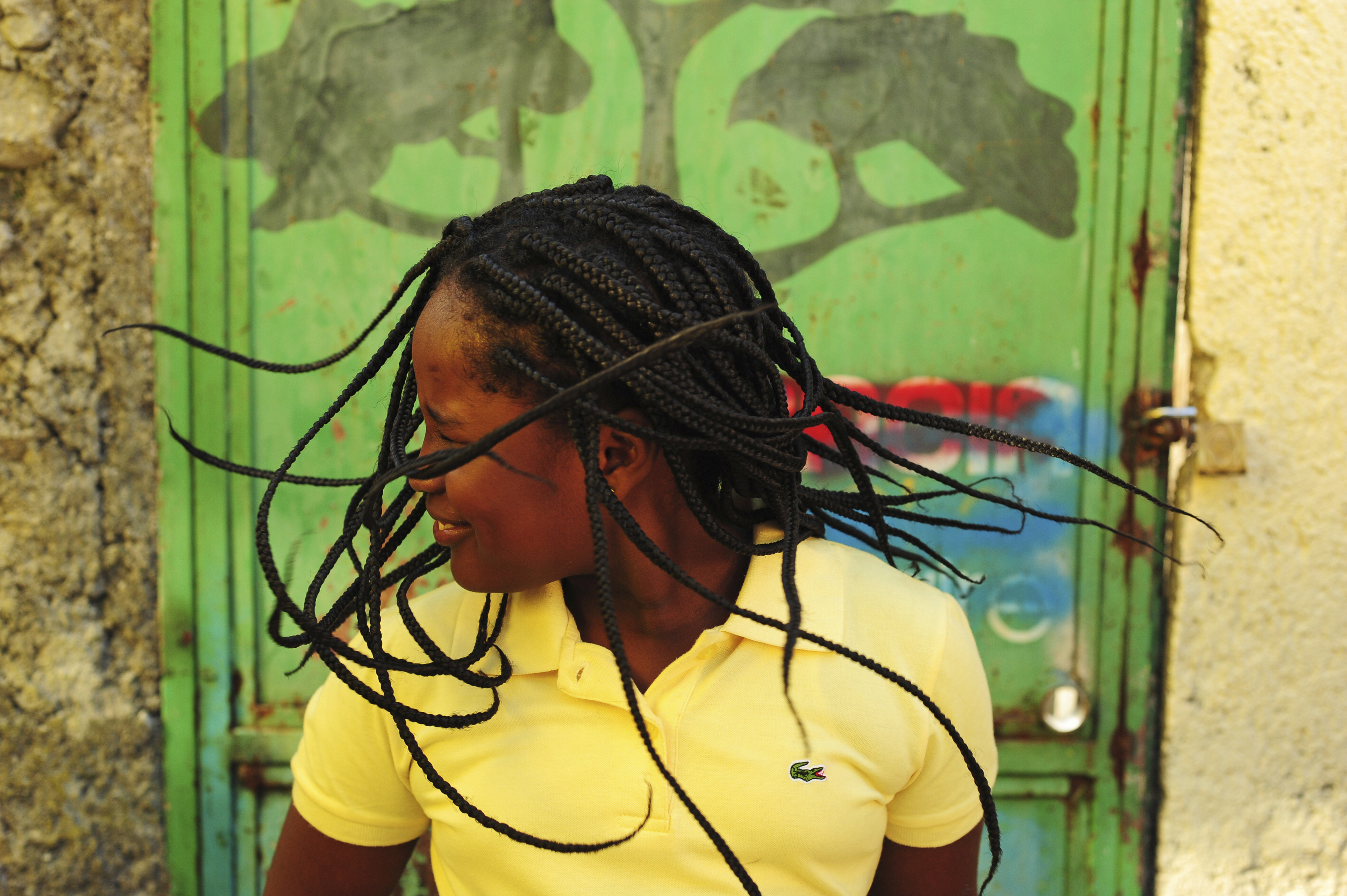Girl dancing and shaking her braids