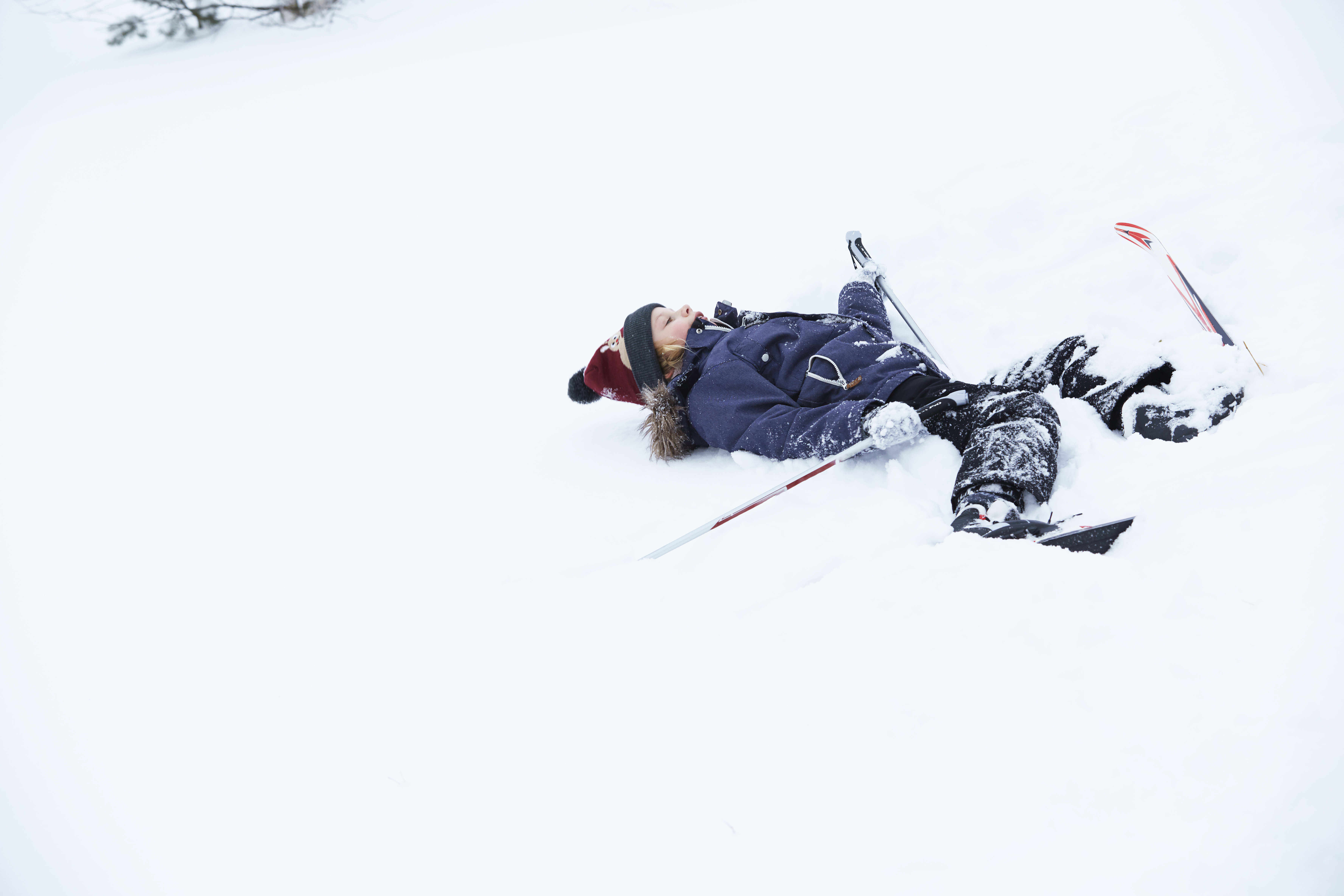 Girl lying in snow
