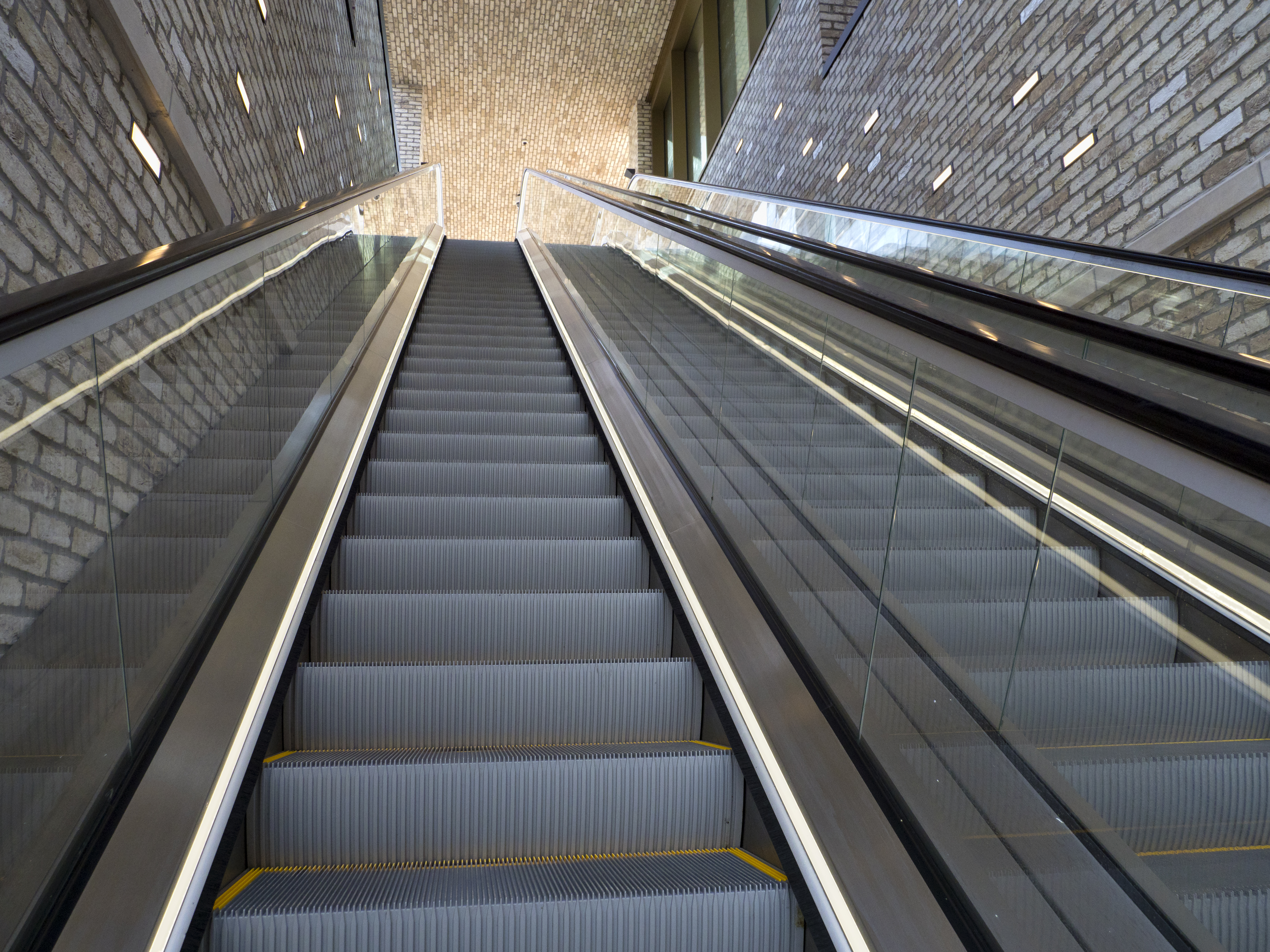 Going up an escalator in Westgate, Oxford