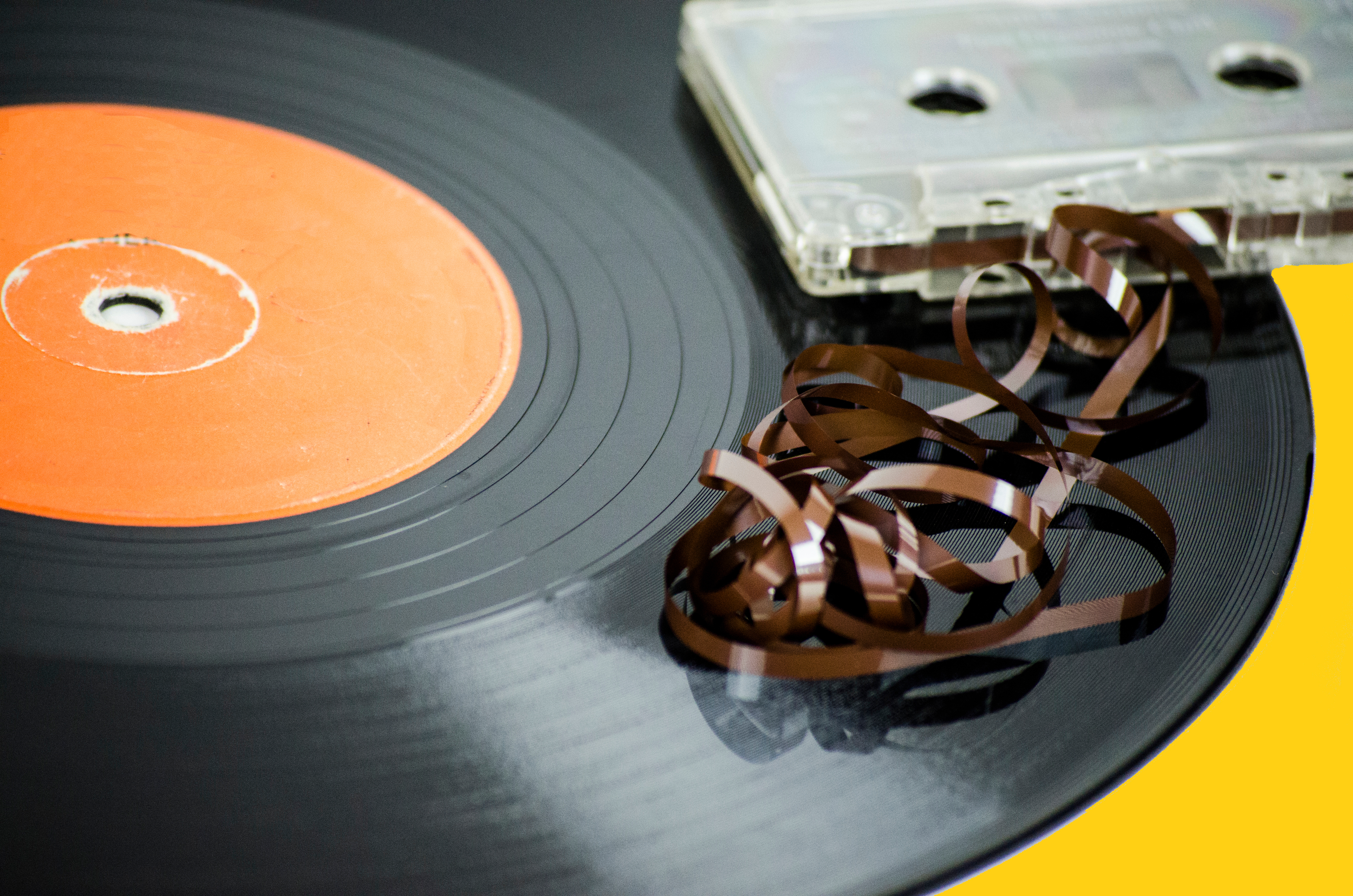 Close-Up Of Record Player Needle And Audio Cassette