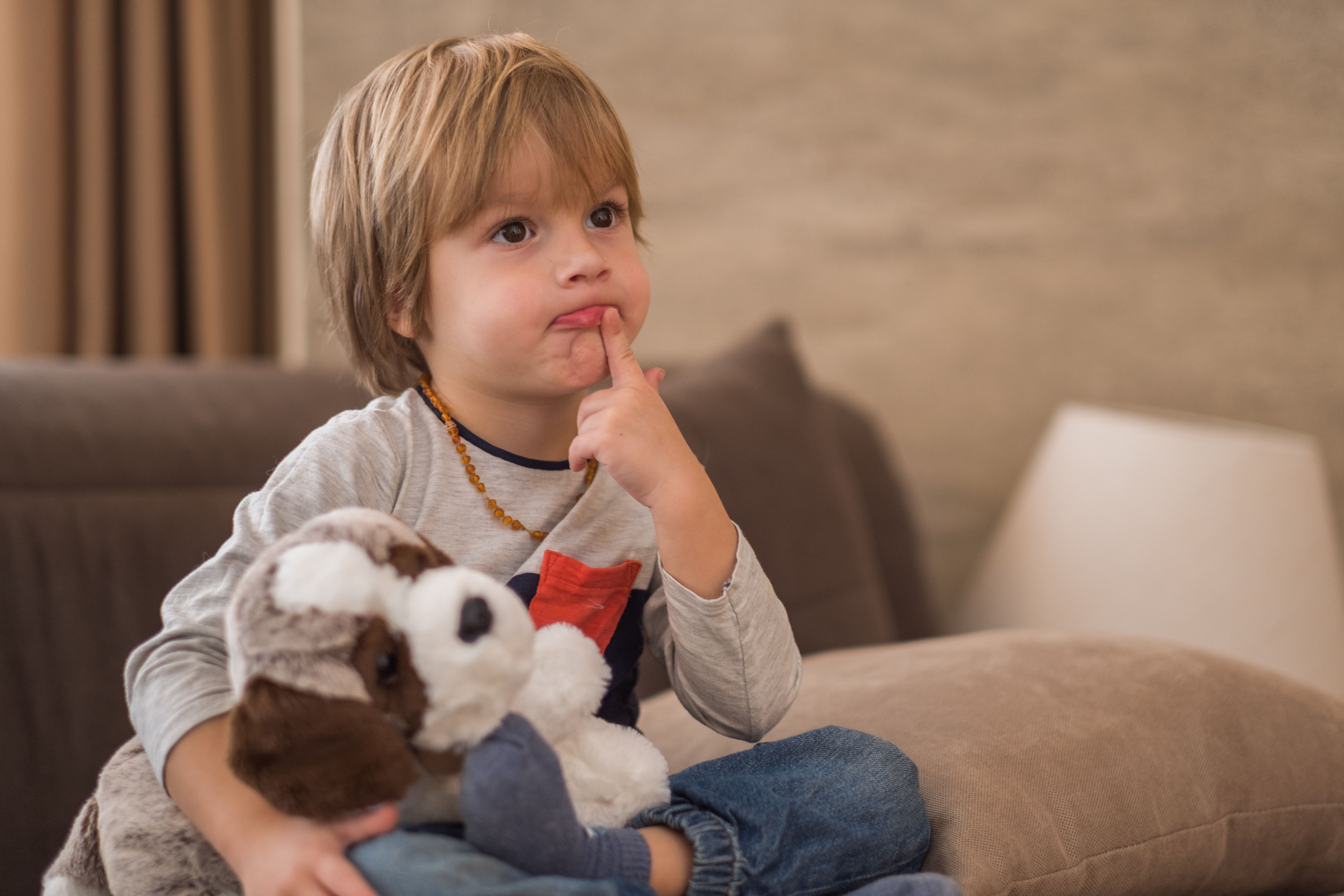 Serious boy watching TV