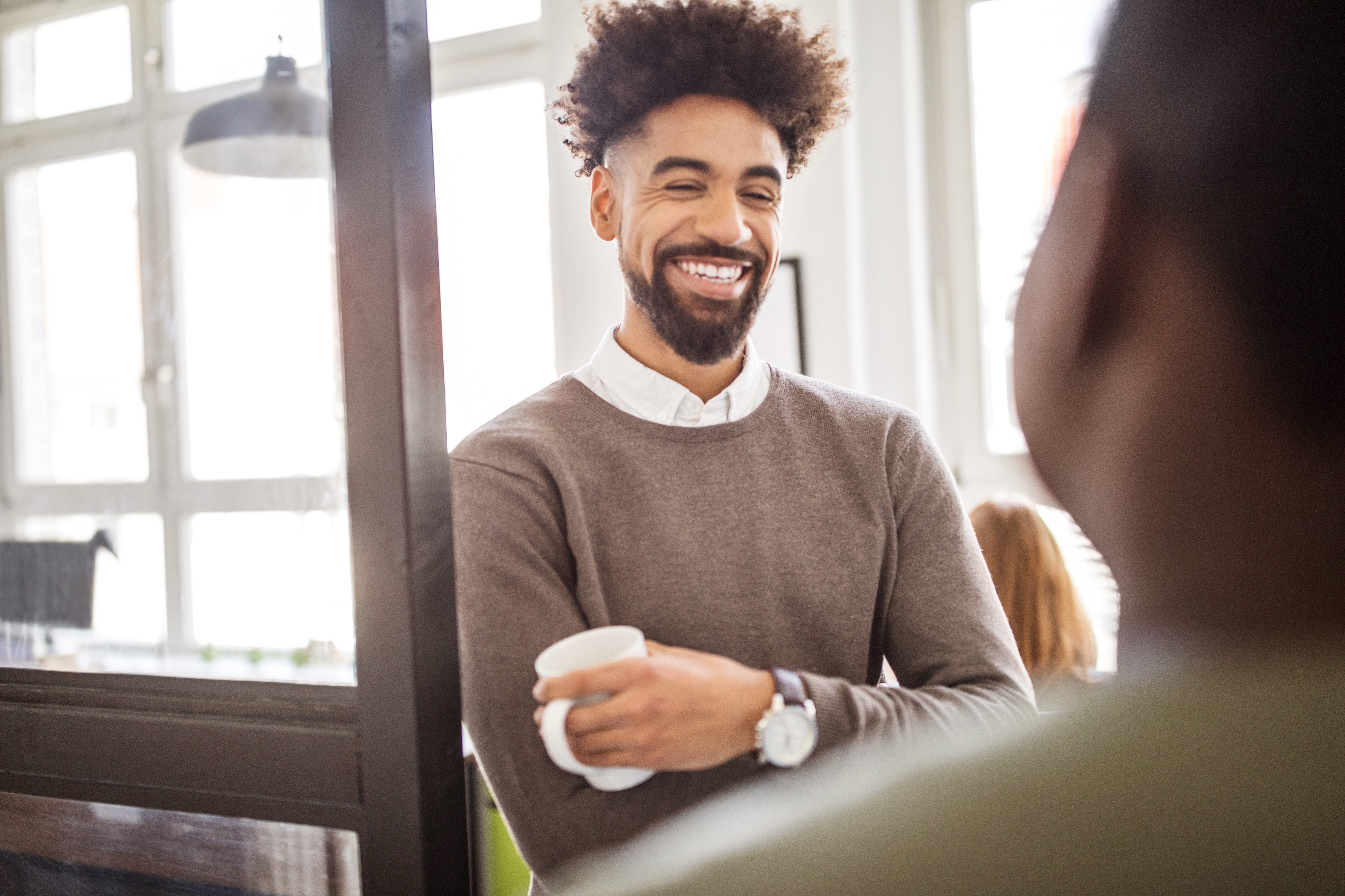 Professionals having a casual discussion in break