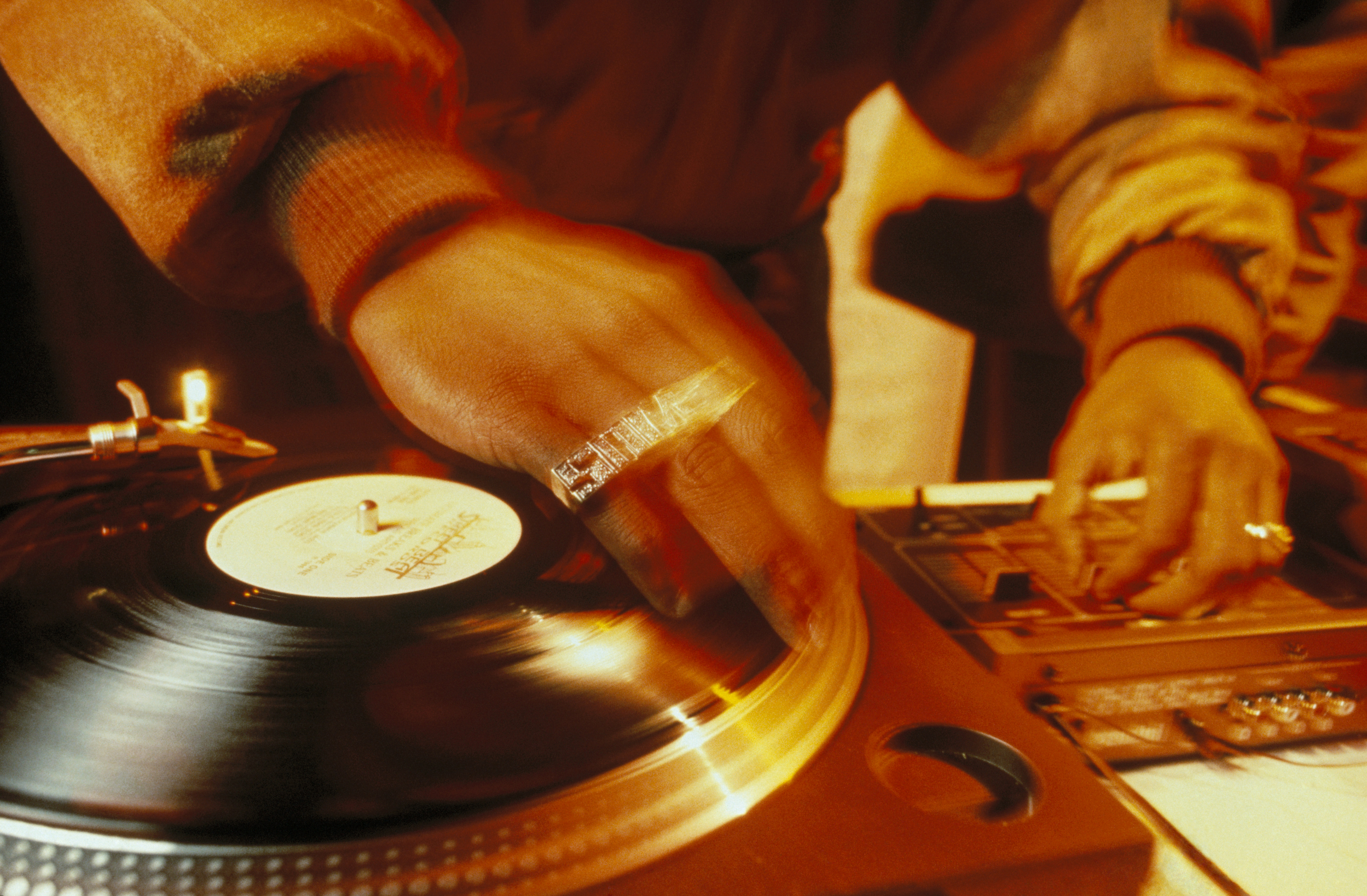 Close-up of Jungle Brothers DJ, Sammy B scratching in the UK, 1990s