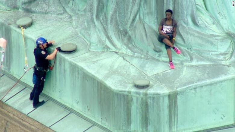 Therese Patricia Okoumou scales the Statue of Liberty on July 4, 2018