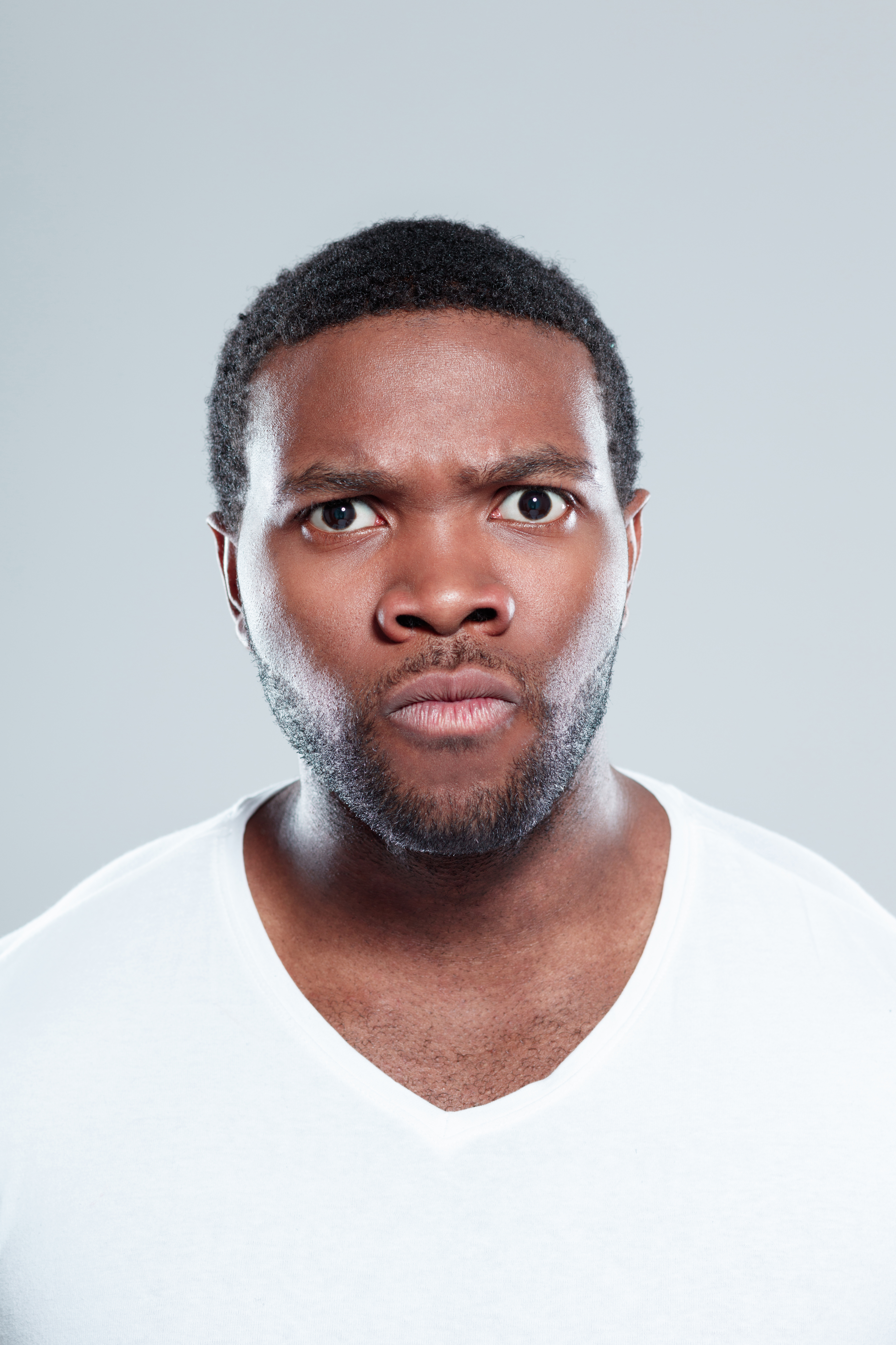 Young afro american man looking angry