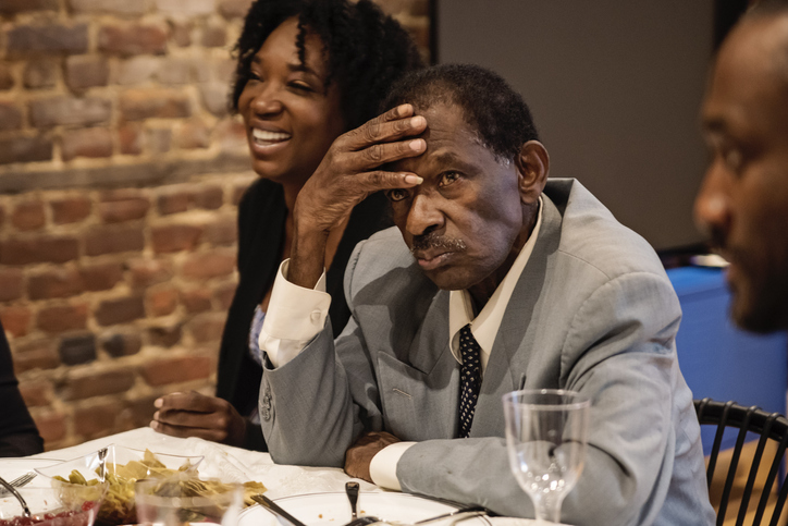 Multi-generation family enjoying Thanksgiving dinner.