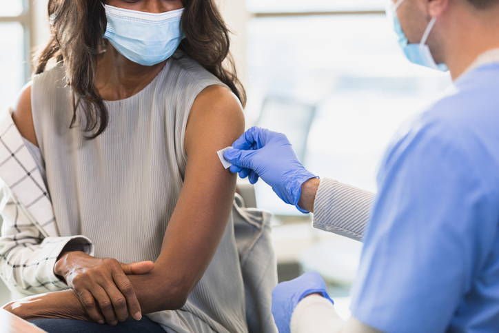 Doctor prepares injection site