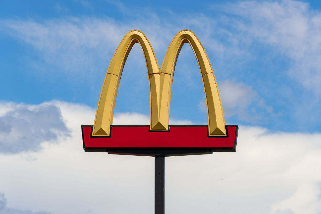 The McDonald's logo is seen above the restaurant in...