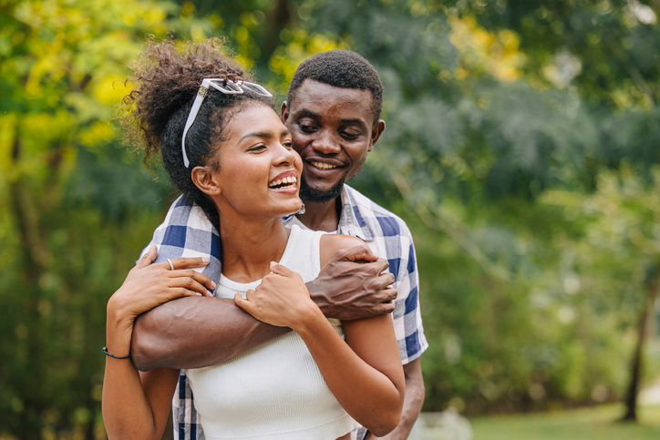Date couple man and women valentine day. African black lover at park outdoors summer season vintage color tone