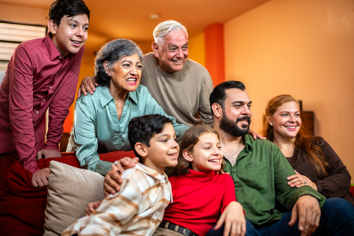 Family together posing for photo at home